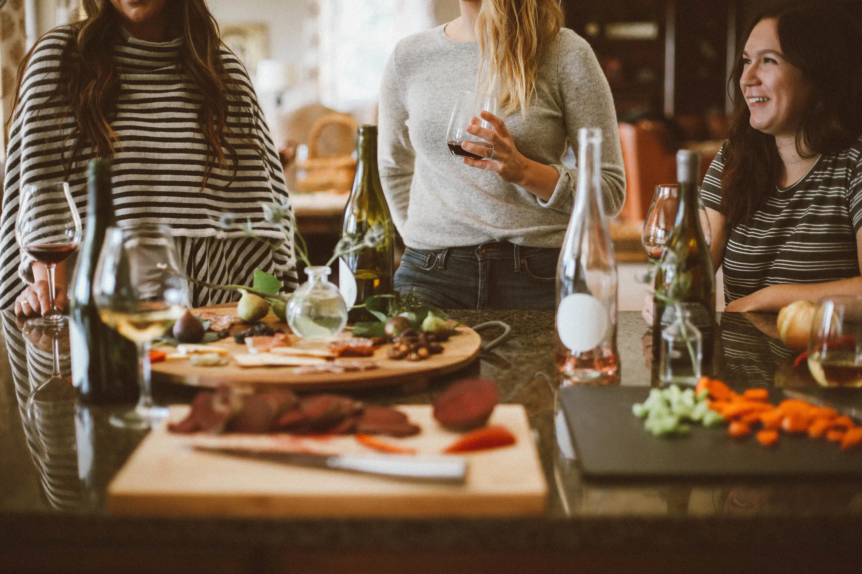 women drinking wine and appetizers